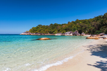 Fototapeta premium The beautiful and secluded Moken Bay of Boulder Island in Myanmar covering with so many boulders on the beach