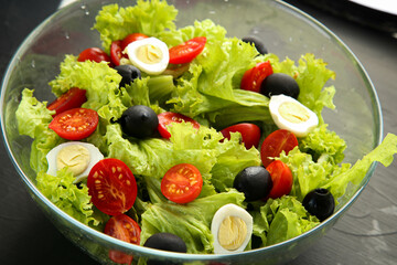 Salad with cherry, olives and eggs. Healthy eating concept