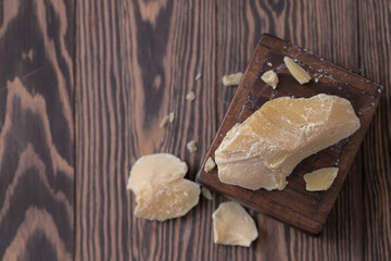 Raw organic Cocoa butter. Chocolate ingredient. Space for text