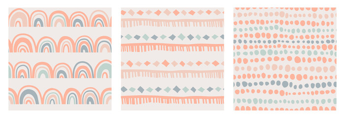 Set of kids boho seamless patterns with rainbow, stripes and dots in doodle style in a natural color palette. Pastel naive nursery print design on a light background. Trendy contemporary kids backdrop © AutumnStudio