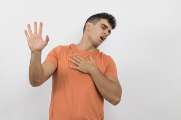 Fototapeta premium a handsome young man making a gesture complaining about something on a white background.