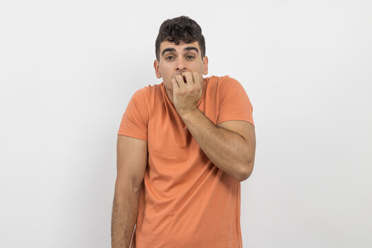 a nervous young guy on a white background.
control anxiety