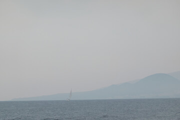 A sailboat sails near Radazul. Tenerife. Canary Islands. Spain