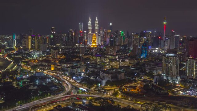 Aerial Hyperlapse of Kuala Lumpur cityscape at night.