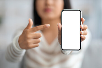 Mobile Ad. Unrecognizable Lady Pointing At Smartphone With Blank White Screen