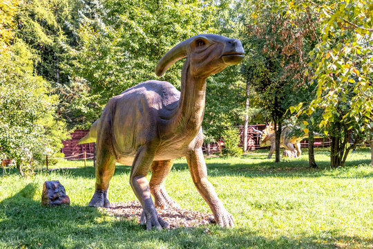 Ukraine, Khmelnitsky, October 2021.  Dinosaur model in the park. Giant parasaurolophus at an exhibition in the park on a summer sunny day
