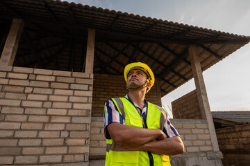 Foreman inspecture new house building holding tablet computeer for record data