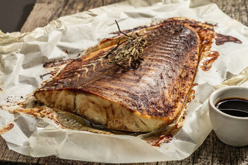 Baked pollock (Pollachius virens) fillet. Fish with teriyaki sauce for healthy food lifestyle
