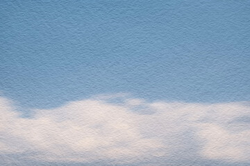 Watercolor blue sky painting on textured paper.