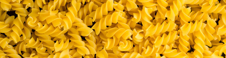 banner of Background of A pile of pasta spiral fusilli