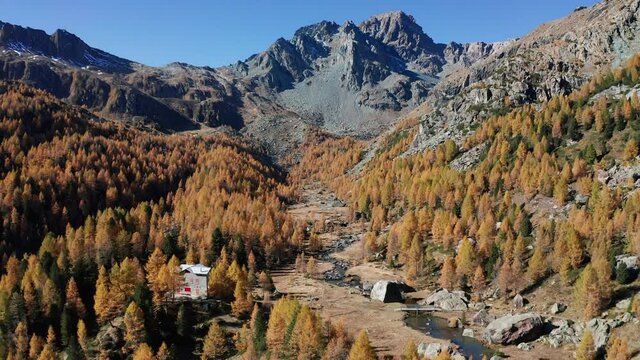 Aerial 4K - Torreggio Valley near the Bosio refuge in Valmalenco, Italy, aerial view in autumn