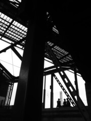 people and Steel beam silhouettes have white sky background