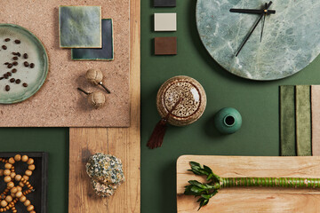 Stylish flat lay composition of creative architect moodboard design with samples of building, textile and natural materials and personal accessories. Top view, green background, template.