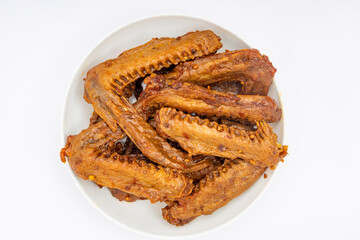 A dish of delicious spicy marinated duck wings