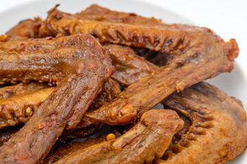 A dish of delicious spicy marinated duck wings