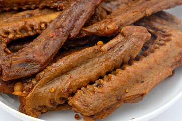 A dish of delicious spicy marinated duck wings