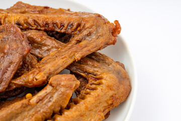 A dish of delicious spicy marinated duck wings