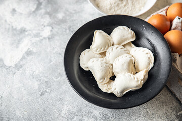 homemade dumplings raw  vareniki stuffed vegetables or meat portion ready to eat meal snack on the table copy space food background rustic. top view