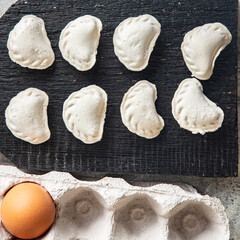 homemade dumplings raw  vareniki stuffed vegetables or meat portion ready to eat meal snack on the table copy space food background rustic. top view