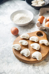 homemade dumplings raw  vareniki stuffed vegetables or meat portion ready to eat meal snack on the table copy space food background rustic. top view