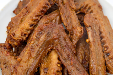 A dish of delicious spicy marinated duck wings