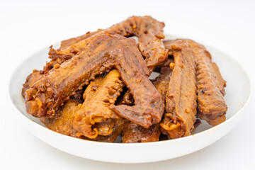A dish of delicious spicy marinated duck wings