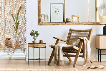 Unique living room interior with stylish rattan armchair,  design furniture, dried flowers, mock up...