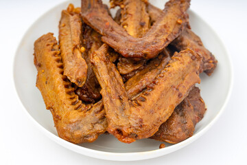 A dish of delicious spicy marinated duck wings