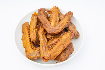 A dish of delicious spicy marinated duck wings
