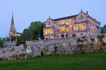Sobrellano palace illuminated at night in Comillas, Cantabria, Spain.