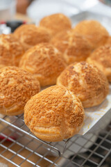 Homemade Craquelin Choux biscuits (crispy cream puffs).