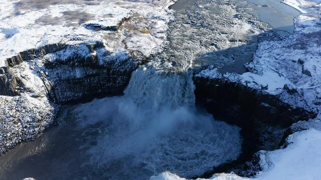 Hafragilsfoss waterfall with snow in autumn 4k aerial view, Iceland