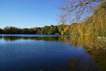 Fototapeta na wymiar Idyllic autumn scene at the lake Black Sea (Schwarzer See), Hanover Garbsen, Germany.