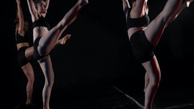 Transcendental dance group women dancing in the dark improvisation in movements