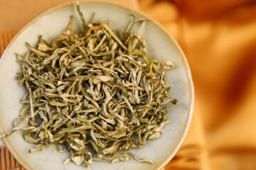 Chinese Fujian boutique fried dried tea leaves in a plate