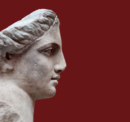 Copy of the antique goddess Diana statue isolated on a red background. Design element with clipping path