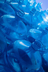 Blue plastic bottle for the cooler. 5 Gallon Polycarbonate PET Bottle for Drinking Water. Folded...