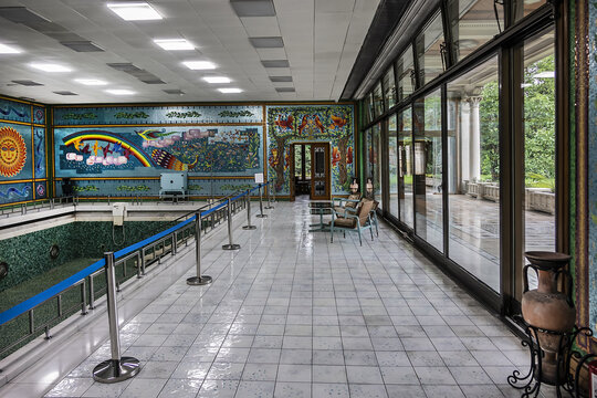 Interior of Ceausescu Palace (or Spring Palace) - building where Romania's former Communist leader, Nicolae Ceausescu lived. Swimming pool with incredible mosaics. BUCHAREST, ROMANIA. JUNE 18, 2021.