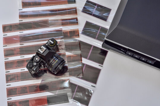 Film photography and scanning photo negatives using a scanner. Film camera with films negative various formats and scanner for scanning and digitizing analog images.