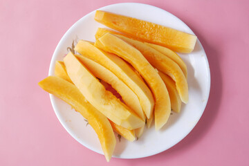 slice of papaya on white plate ,