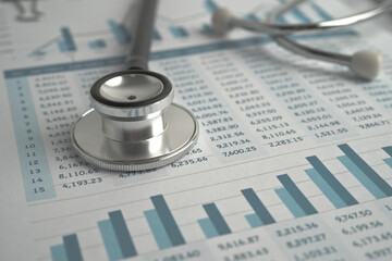 Stethoscope on spreadsheet paper, Finance, Account, Statistics, Investment, Analytic research data economy spreadsheet and Business company concept.