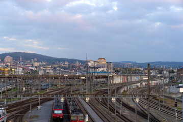 Naklejka na ściany i meble Aerial view of train at track field of Zürich main station on a sunny autumn evening. Photo taken October 9th, 2021, Zurich, Switzerland.