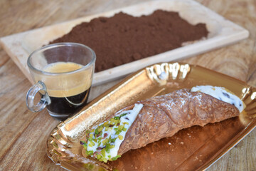 espresso coffee  with a cannolo and gound coffee