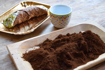 ground coffee and sicilian cannolo