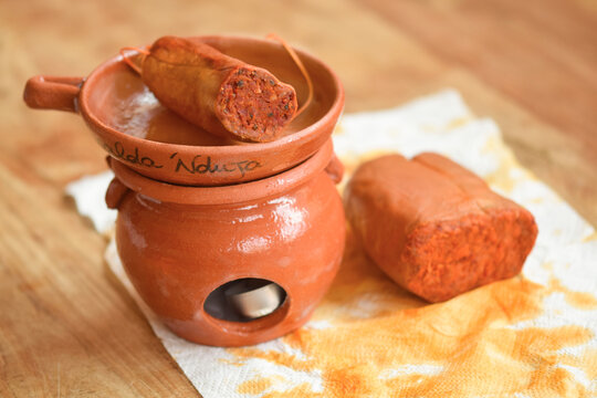 terracotta scaldanduja with two kind of nduja