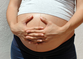 Pregnant woman about to give birth. Young latin woman waiting for the happy birth of her first baby 