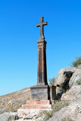 Armenia, Khor Virap, September 2021. An ancient stone monument with a cross at the walls of the monastery.
