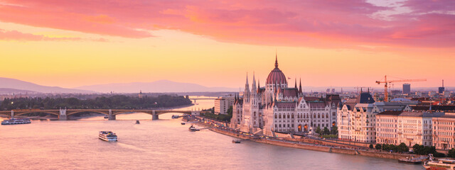 City summer sunset landscape, panorama, banner - top view of the Hungarian Parliament Building and Danube river with Margaret Bridge in the historical center of Budapest, in Hungary