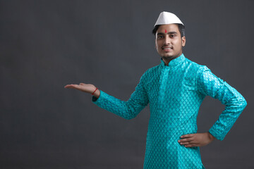 Young indian man (pilgrim) in traditional wear.