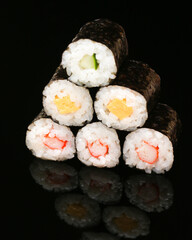 Sesame California Rolls with sesame seeds around